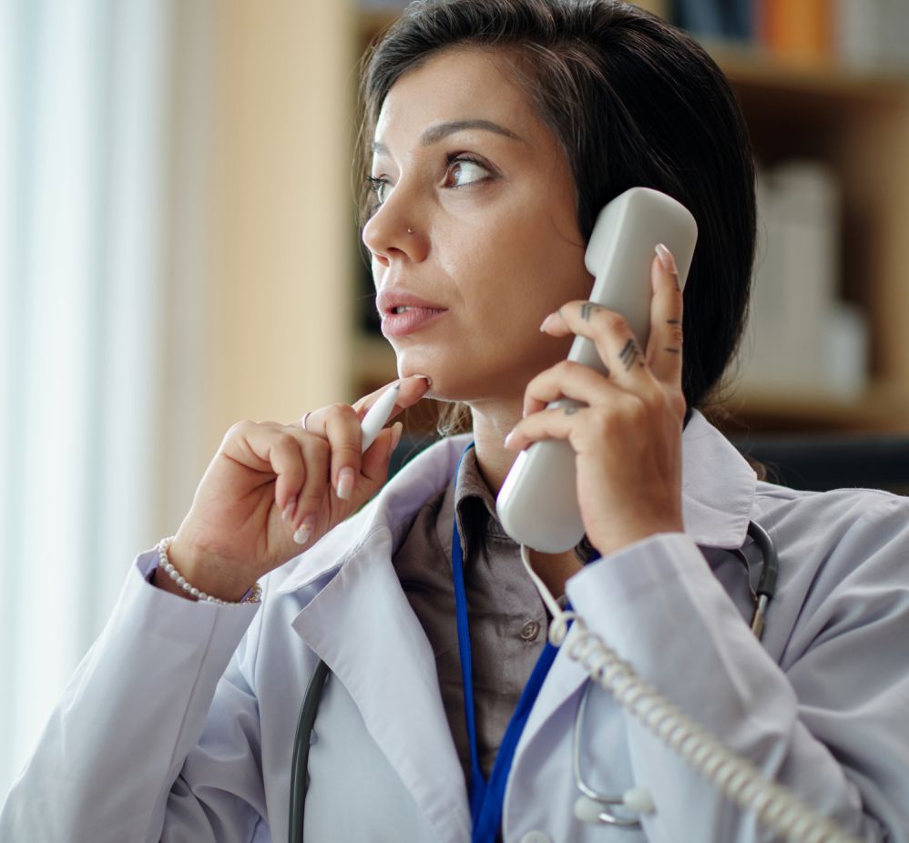 doctor on the phone thinking