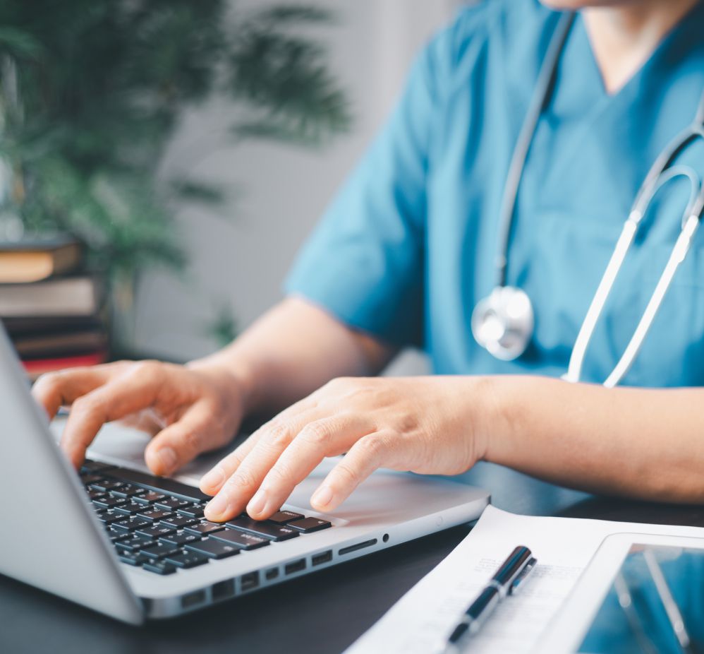 person typing on laptop