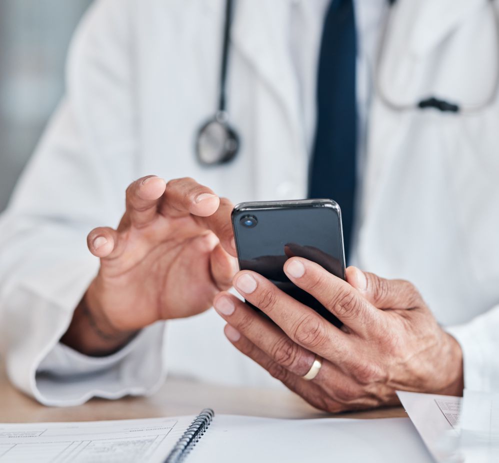 doctor on a phone checking a prescription
