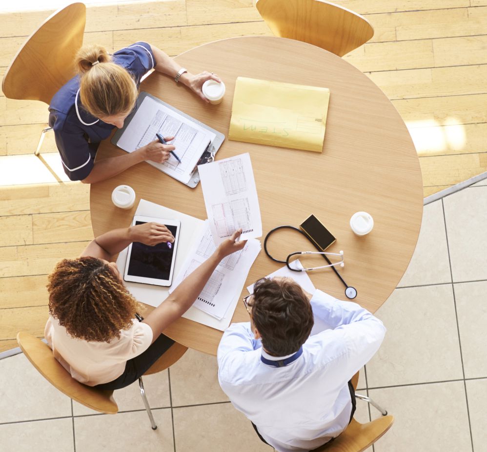 people gather around a table