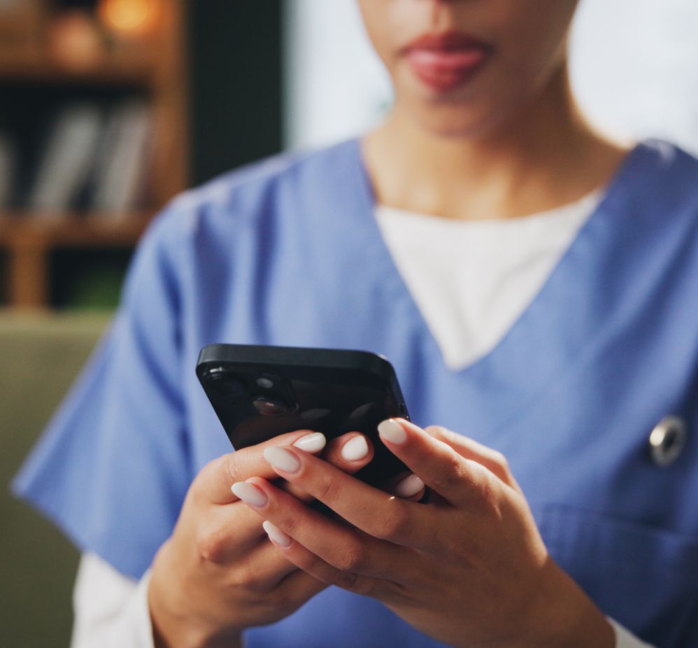 nursing looking at message on phone