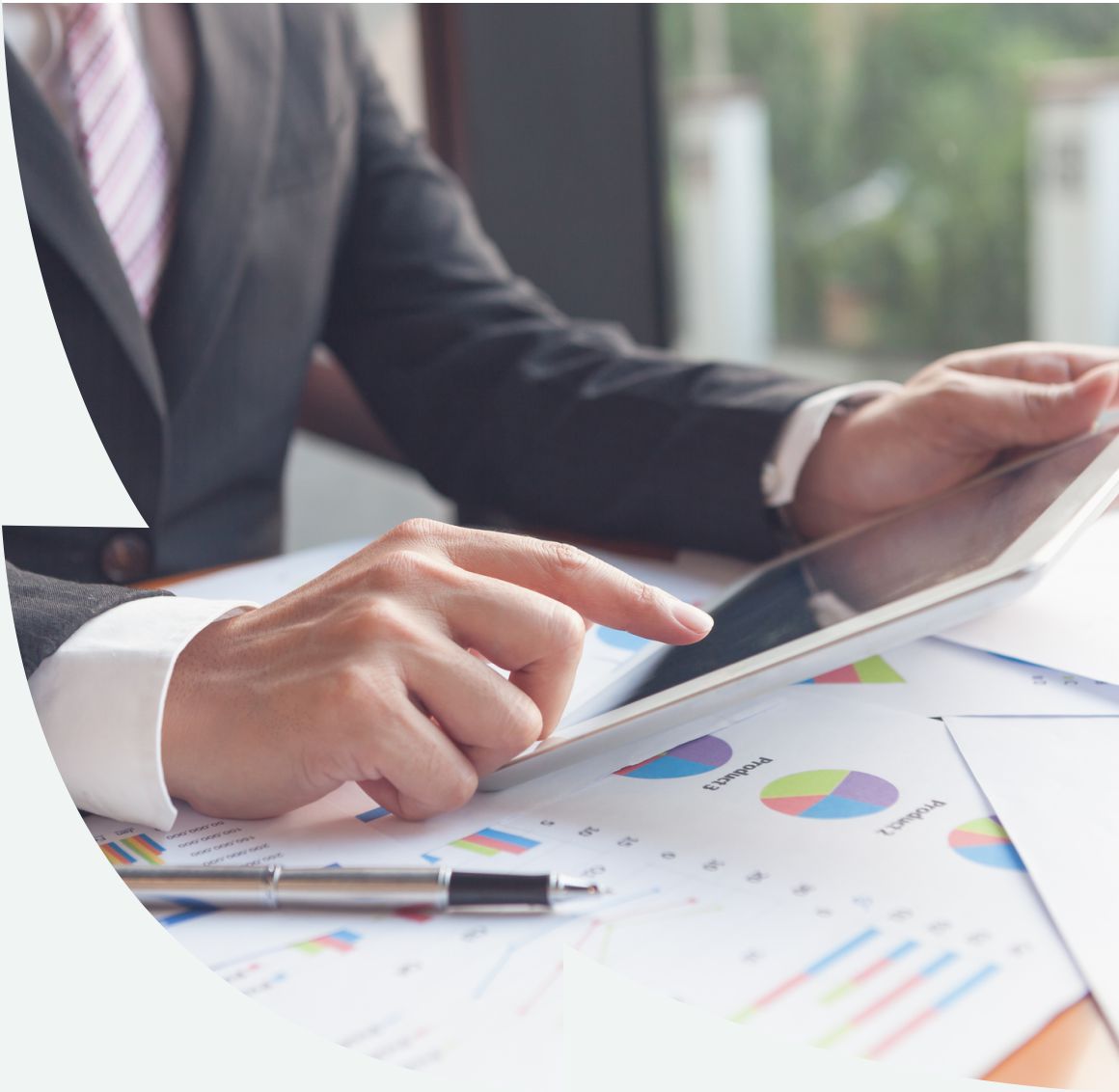 guy sitting at desk with graphs and charts guy sitting at desk with graphs and charts